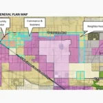 Map titled "Existing General Plan Map" showing current land use designations around the Sacaton Mine site in Casa Grande. Three parcels are outlined in teal and labeled Community Corridor, Commerce & Business, and Neighborhoods. West Val Vista Boulevard runs along the top of the map, and the West Maricopa-Casa Grande Highway runs diagonally through the southwest.