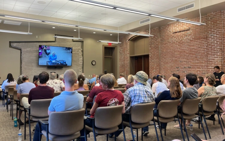 An overflow room filled with attendees watching the La Osa data center hearing