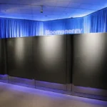 Black Bloom Energy Server cabinets displayed under blue lighting at the company’s 2010 launch.