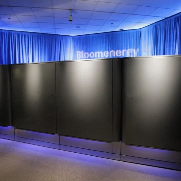 Black Bloom Energy Server cabinets displayed under blue lighting at the company’s 2010 launch.
