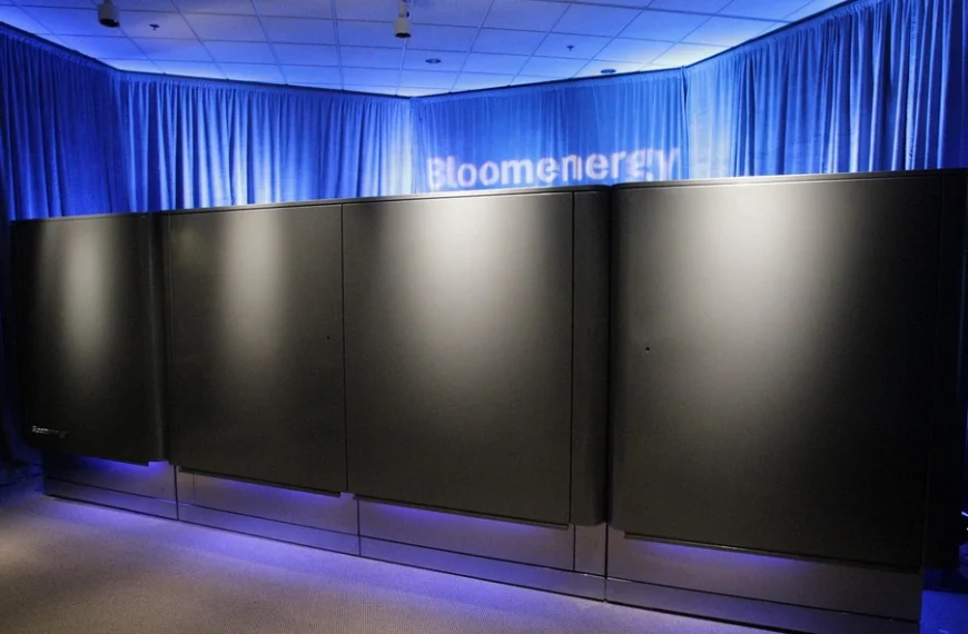 Black Bloom Energy Server cabinets displayed under blue lighting at the company’s 2010 launch.