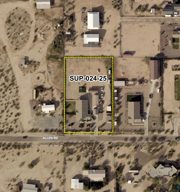 Aerial view of a rural residential neighborhood along Allen Road A yellow dashed rectangle labeled SUP-024-25 outlines a parcel containing a single-story house and several smaller outbuildings set on cleared ground with a small paved driveway and parking area Surrounding parcels are large-lot properties with houses sheds and open desert showing the low-density rural character of the area