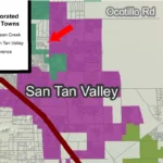Map showing incorporated town boundaries with Queen Creek in green, San Tan Valley in purple and Florence in olive. A red arrow points to the small annexation parcel in unincorporated county land at Gantzel Road and Lone Star Lane, just outside San Tan Valley's boundary.