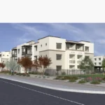Rendering of Bella Norte's three-story apartment buildings along the street, with balconies, desert landscaping and a fenced dog run