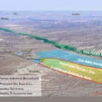Aerial rendering of the Ore Town Solar site beside San Manuel, Arizona. A red outline along Veterans Memorial Boulevard marks the proposed project site on part of a larger blue-shaded former industrial brownfield that includes the old mine tailings between the site and the San Pedro River. A marker at the site's corner shows the existing substation, with an existing transmission line running west past the town and airport.