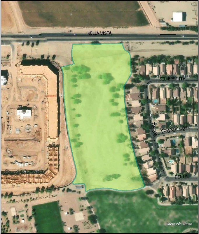 Aerial view of the Rancho BV Park draft site along Bella Vista Road a grassy parcel with scattered trees beside homes